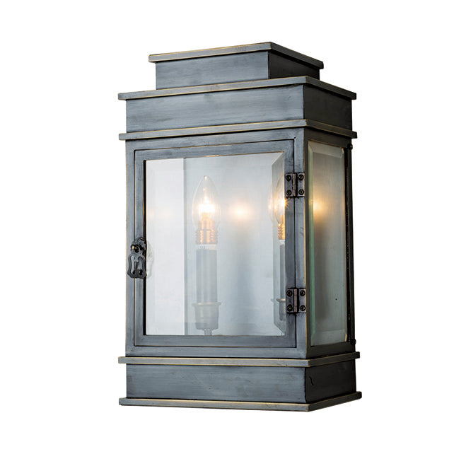 Black exterior wall lantern with clear glass and wide framed edges.