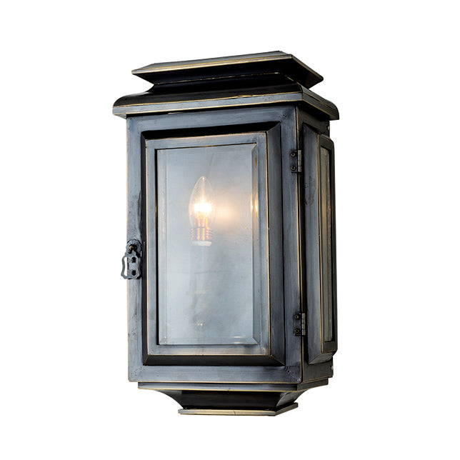 Black exterior wall lantern with clear glass and classic rectangular frame.
